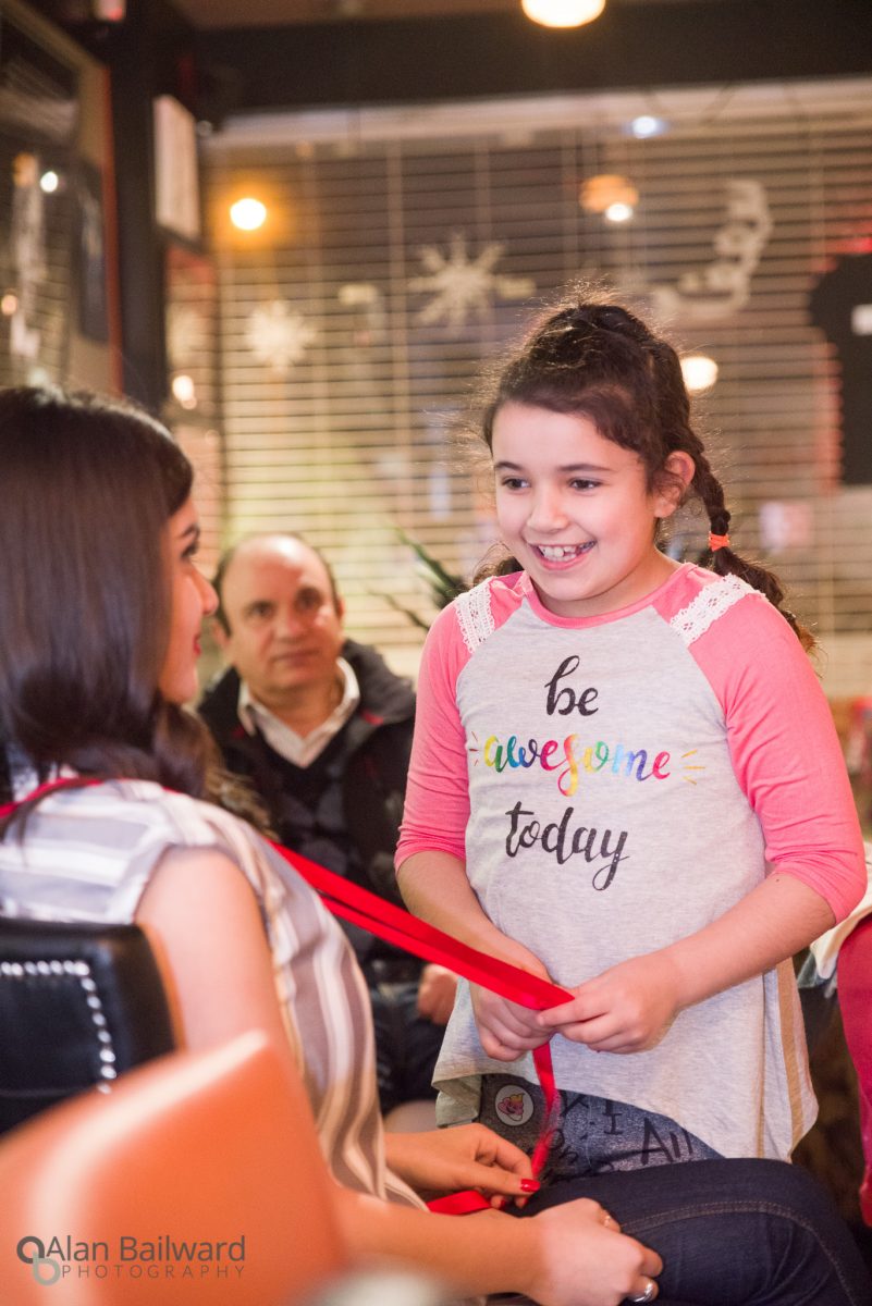 Young girl excited to be helping out