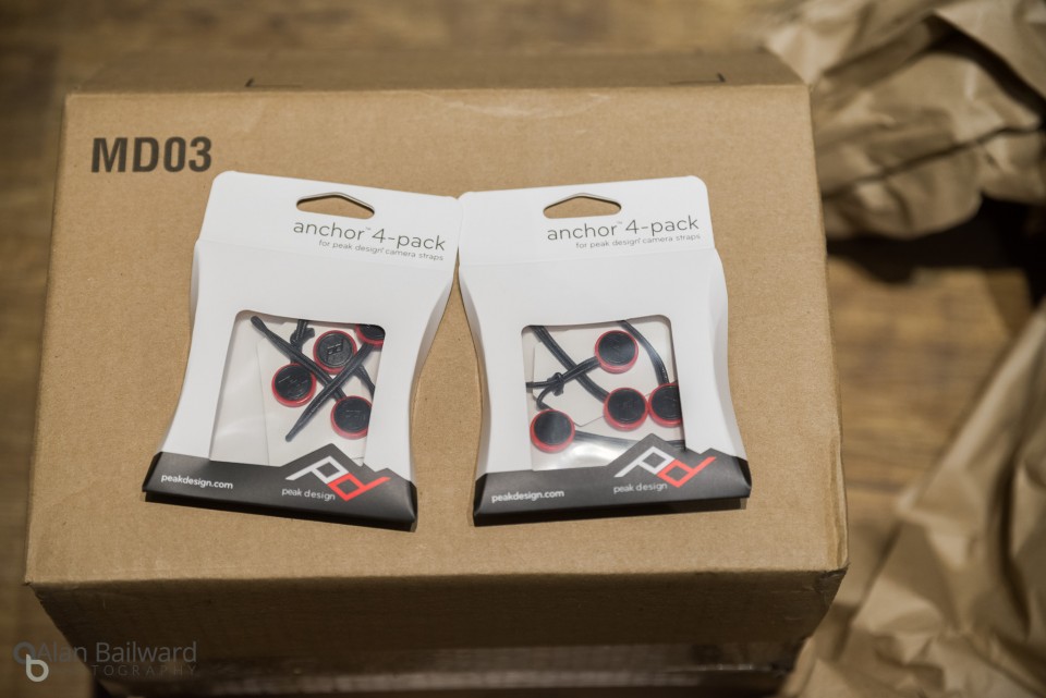 Two small containers on top of the packing box